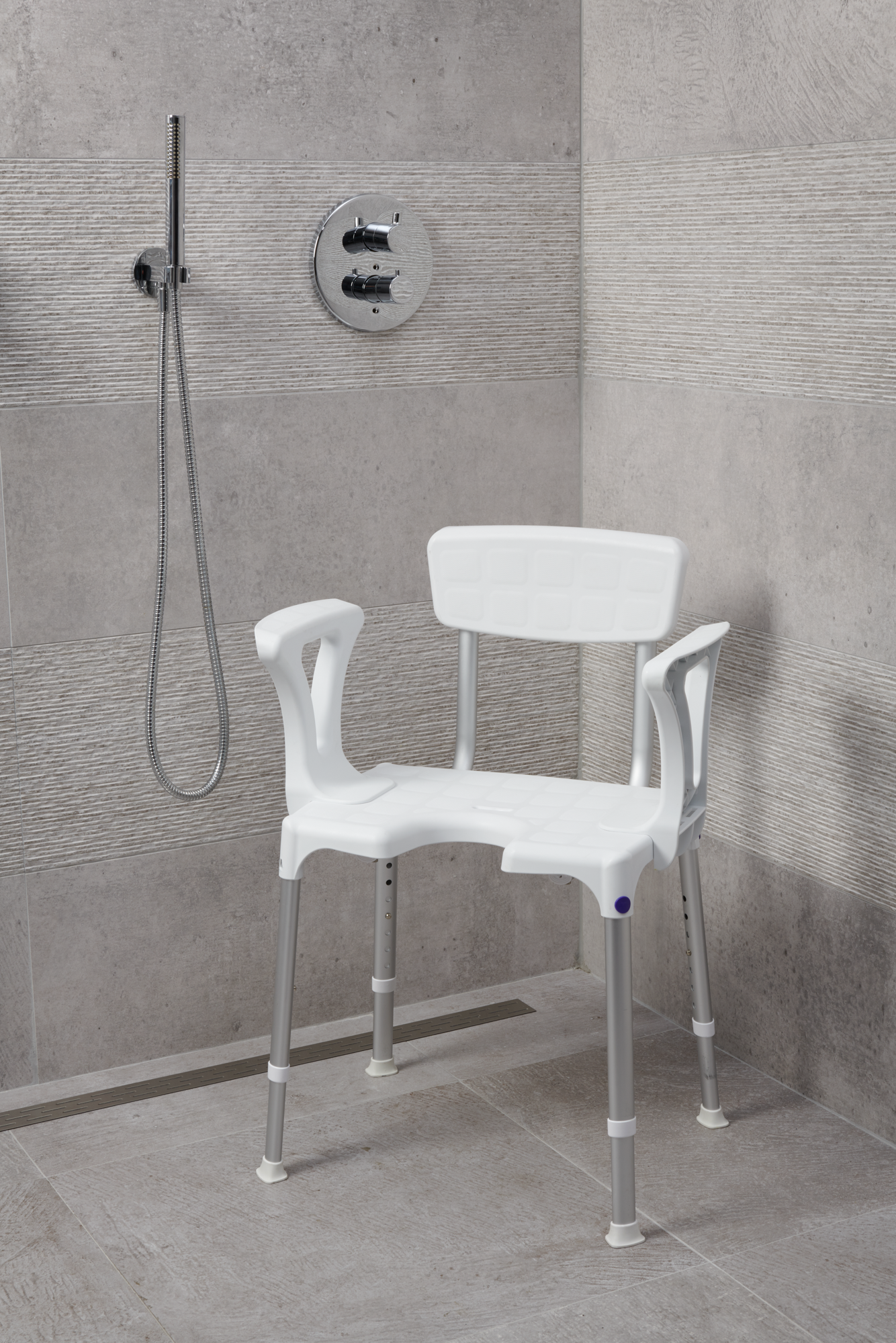 SecuCare Quattro Showerchair with hygiene cutout, backrest and armrests